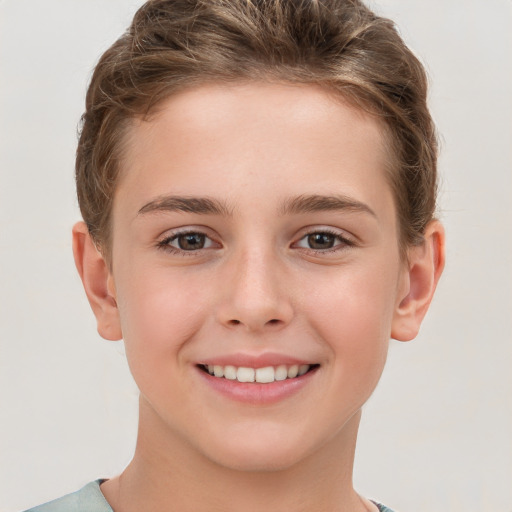 Joyful white child female with short  brown hair and grey eyes