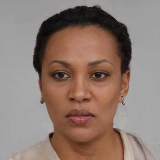Neutral black young-adult female with short  black hair and brown eyes