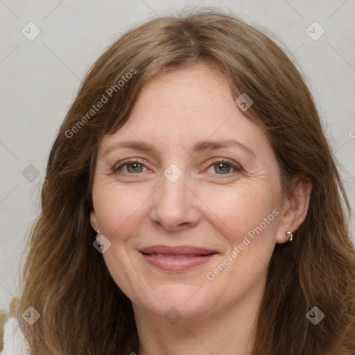 Joyful white adult female with long  brown hair and brown eyes