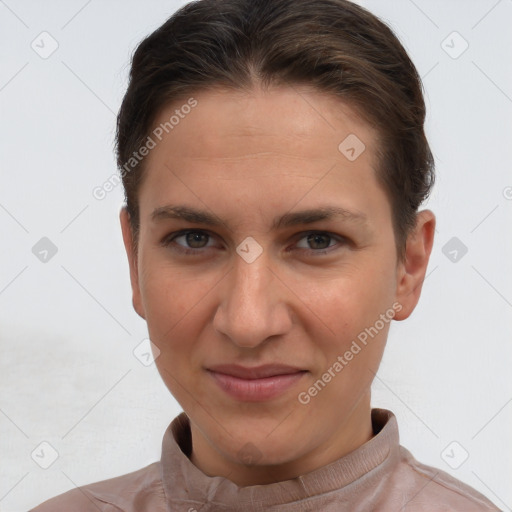 Joyful white young-adult female with short  brown hair and brown eyes