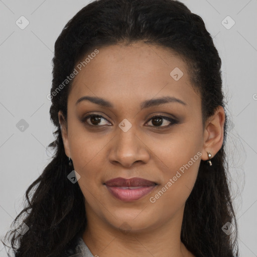 Joyful black young-adult female with long  brown hair and brown eyes