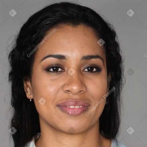 Joyful black young-adult female with long  brown hair and brown eyes