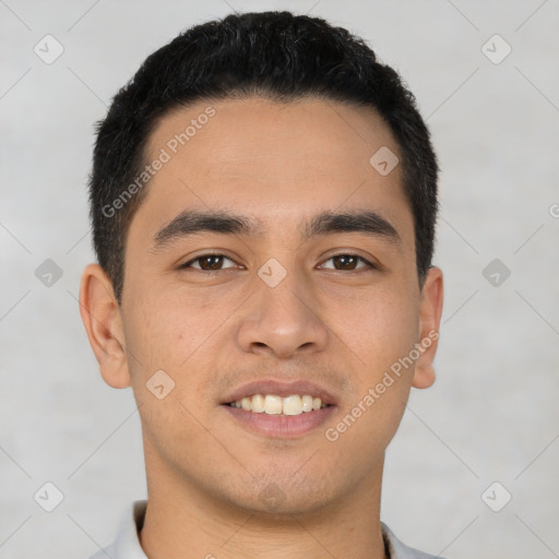 Joyful latino young-adult male with short  black hair and brown eyes