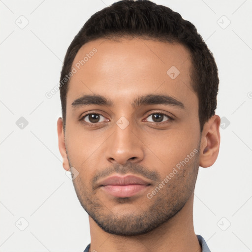 Neutral latino young-adult male with short  black hair and brown eyes