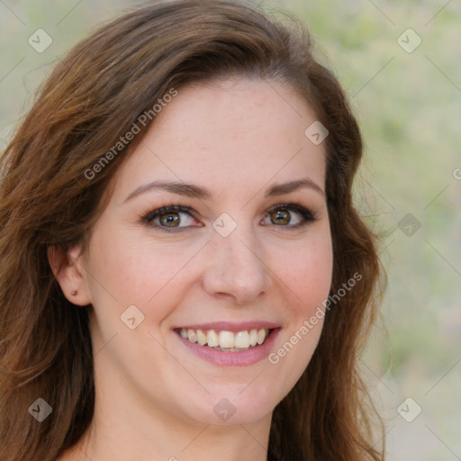 Joyful white young-adult female with long  brown hair and green eyes