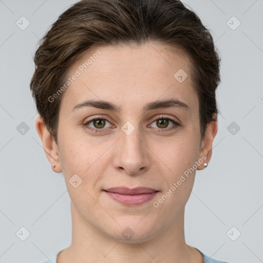 Joyful white young-adult female with short  brown hair and grey eyes