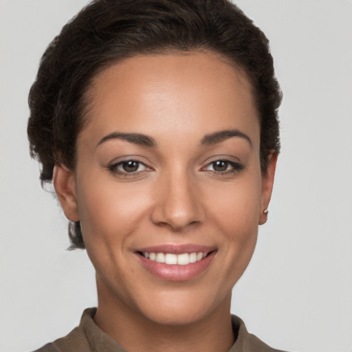 Joyful white young-adult female with short  brown hair and brown eyes