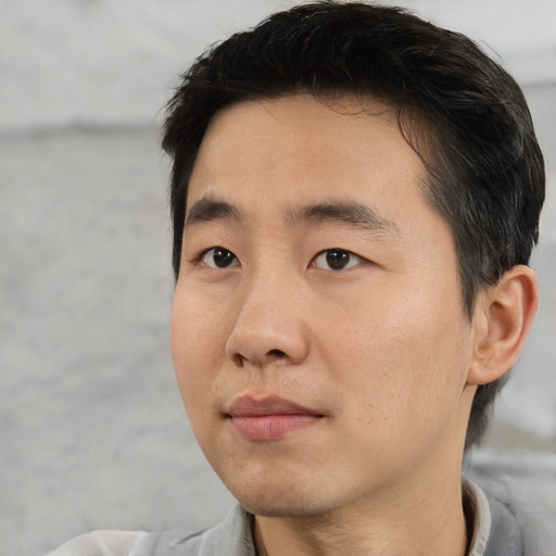 Neutral asian young-adult male with short  black hair and brown eyes