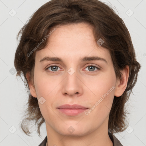 Joyful white young-adult female with medium  brown hair and green eyes