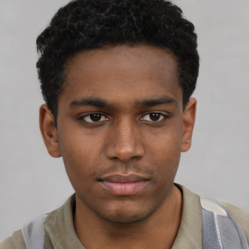 Neutral black young-adult male with short  black hair and brown eyes