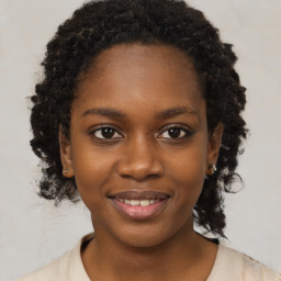 Joyful black young-adult female with medium  black hair and brown eyes