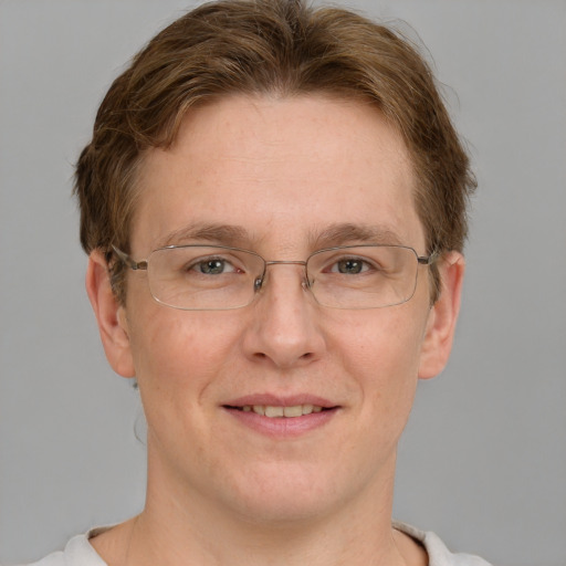 Joyful white adult male with short  brown hair and grey eyes