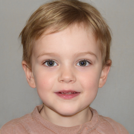 Joyful white child male with short  brown hair and blue eyes