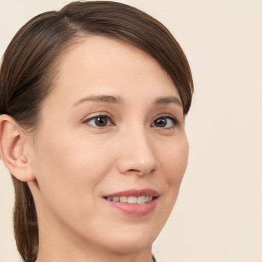 Joyful white young-adult female with medium  brown hair and brown eyes