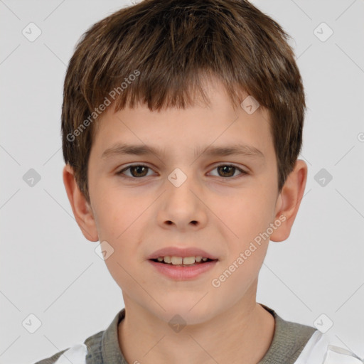 Joyful white child male with short  brown hair and brown eyes