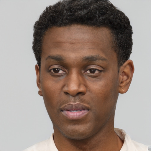 Neutral black young-adult male with short  black hair and brown eyes