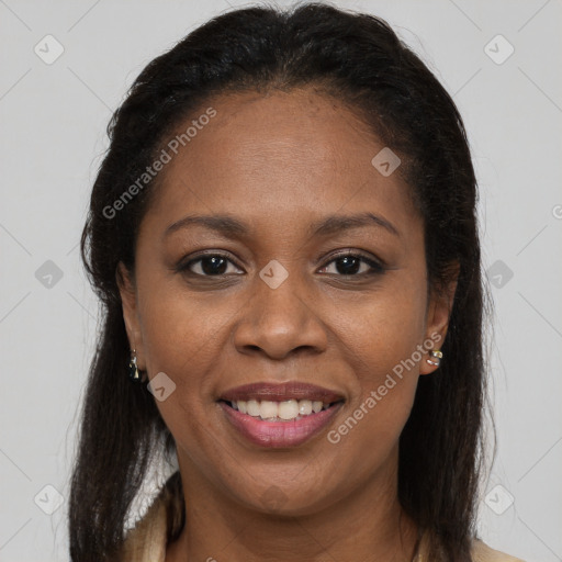 Joyful black young-adult female with long  brown hair and brown eyes