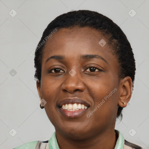 Joyful latino young-adult female with short  black hair and brown eyes