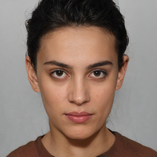 Neutral white young-adult female with short  brown hair and brown eyes