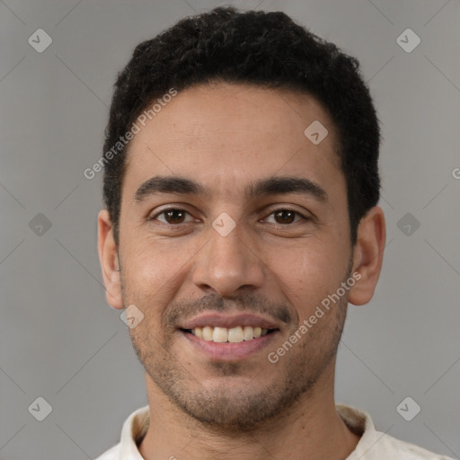 Joyful white young-adult male with short  black hair and brown eyes