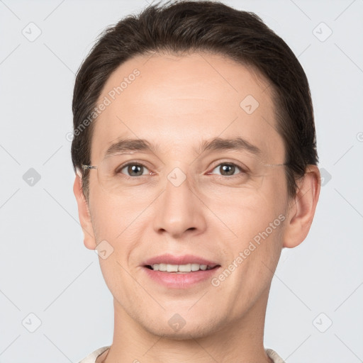 Joyful white adult male with short  brown hair and brown eyes