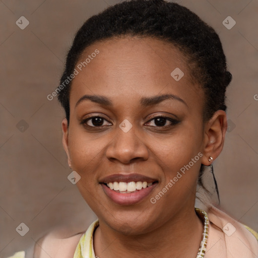 Joyful black young-adult female with short  brown hair and brown eyes