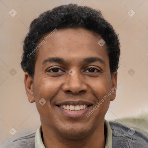 Joyful latino young-adult male with short  brown hair and brown eyes