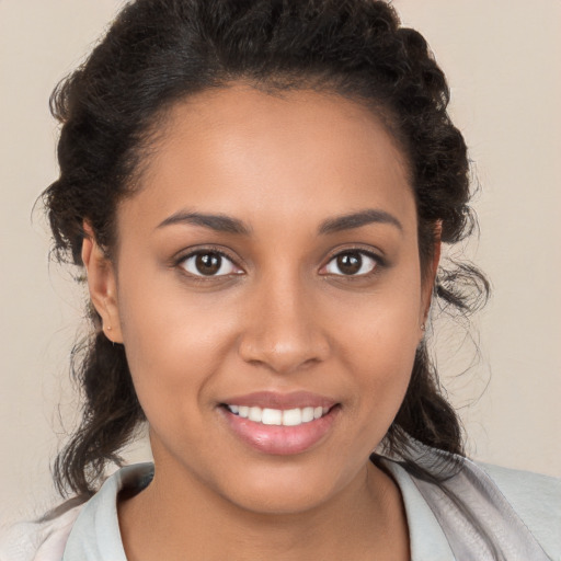 Joyful white young-adult female with medium  brown hair and brown eyes