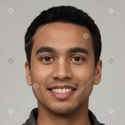 Joyful latino young-adult male with short  black hair and brown eyes