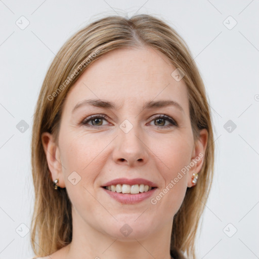 Joyful white young-adult female with long  brown hair and grey eyes