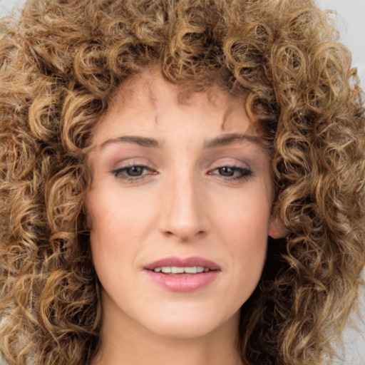 Joyful white young-adult female with medium  brown hair and green eyes