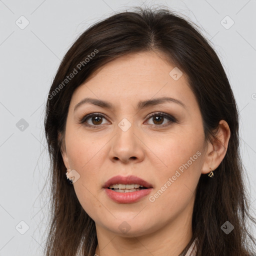 Joyful white young-adult female with long  brown hair and brown eyes