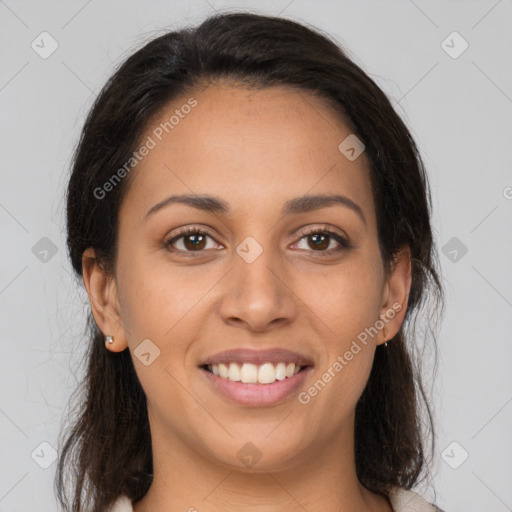 Joyful latino young-adult female with medium  brown hair and brown eyes