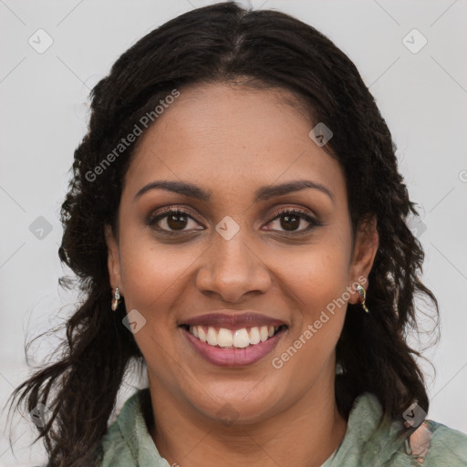 Joyful black young-adult female with long  brown hair and brown eyes