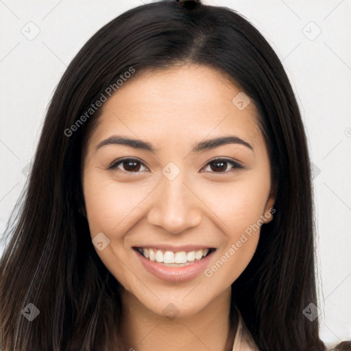 Joyful latino young-adult female with long  brown hair and brown eyes