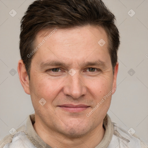 Joyful white adult male with short  brown hair and grey eyes