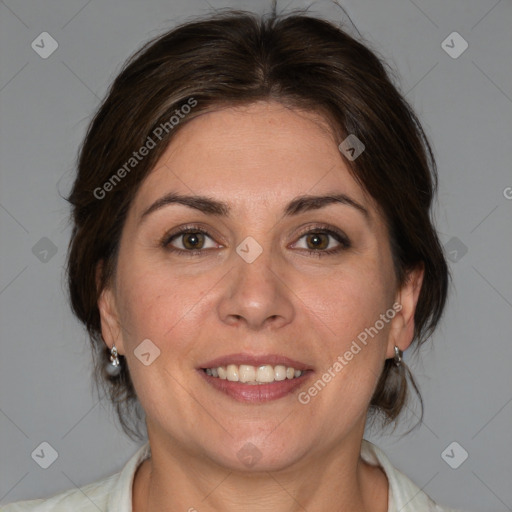 Joyful white adult female with medium  brown hair and brown eyes