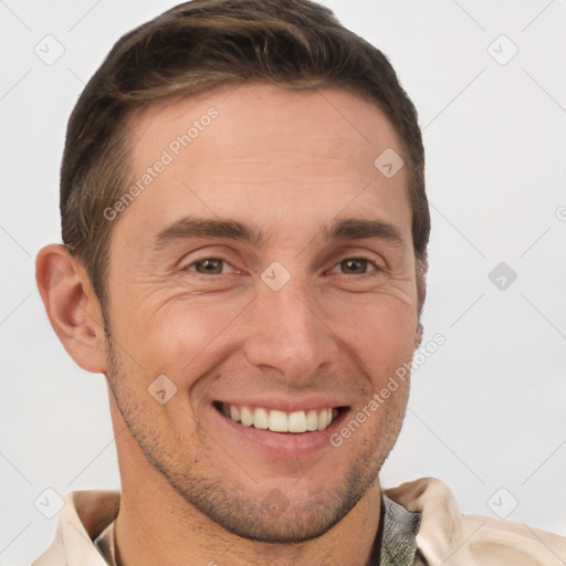 Joyful white adult male with short  brown hair and brown eyes