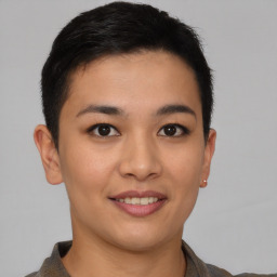 Joyful asian young-adult female with short  brown hair and brown eyes