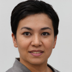 Joyful asian young-adult female with short  black hair and brown eyes