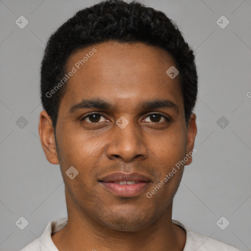 Joyful black young-adult male with short  brown hair and brown eyes