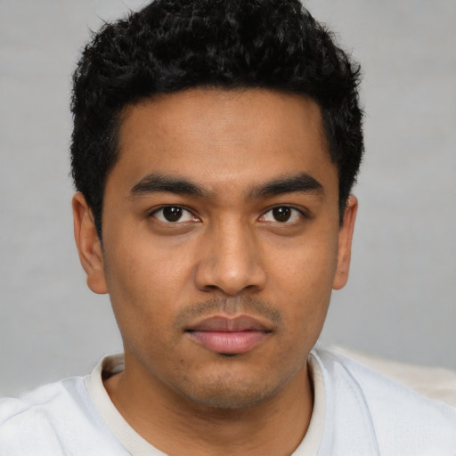 Neutral latino young-adult male with short  brown hair and brown eyes