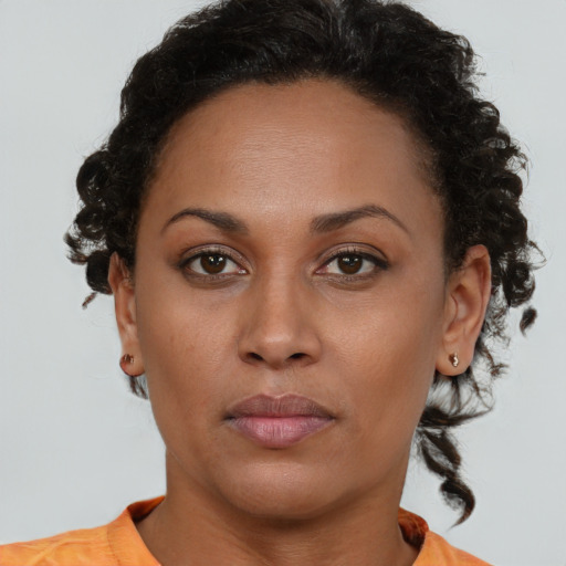 Neutral black young-adult female with short  brown hair and brown eyes