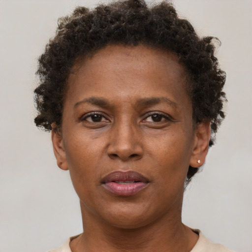 Neutral black adult female with short  brown hair and brown eyes