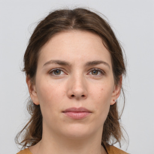 Neutral white young-adult female with medium  brown hair and grey eyes