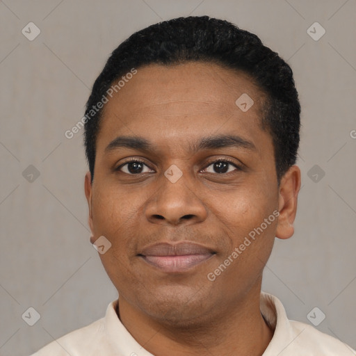 Joyful black young-adult male with short  black hair and brown eyes