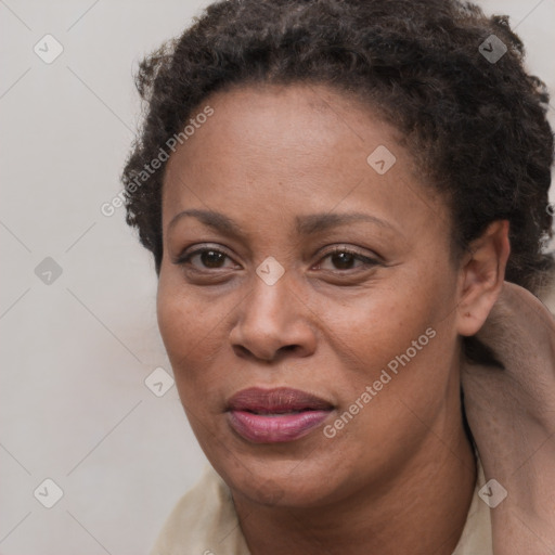 Joyful black adult female with short  brown hair and brown eyes