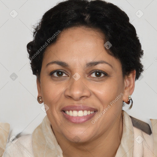 Joyful black adult female with short  brown hair and brown eyes