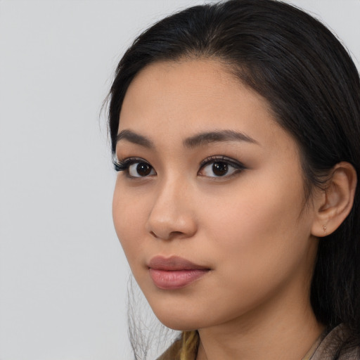 Neutral latino young-adult female with long  black hair and brown eyes