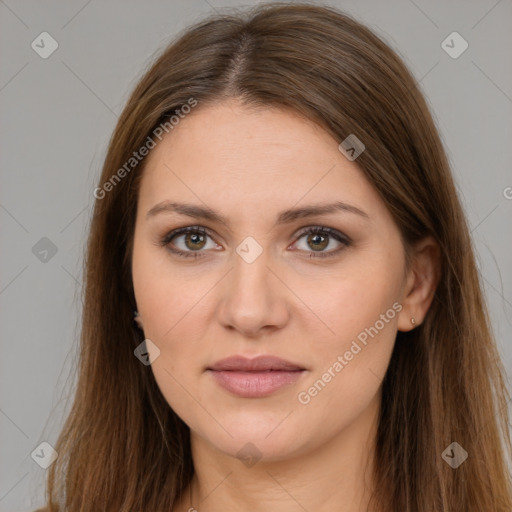 Joyful white young-adult female with long  brown hair and brown eyes